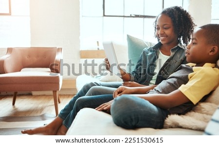 Happiness, tablet and siblings on sofa, social media and bonding in living room, weekend and connection. Love, black brother and sister with device, watching funny videos and search internet for game