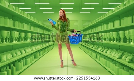 Portrait of young stylish girl standing with shopping busket filled different goods over 3D model of supermarket background. Big sales season, Black Friday concept. Copy space for ad Royalty-Free Stock Photo #2251534163