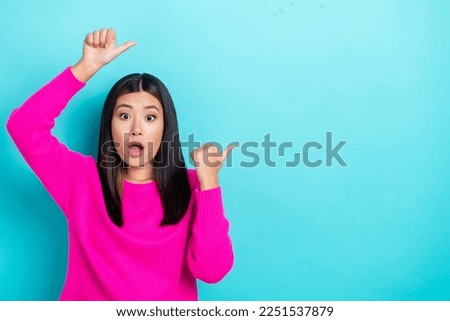 Photo of astonished lady wear pink stylish clothes two arm above head presenting special deal empty space isolated on cyan color background