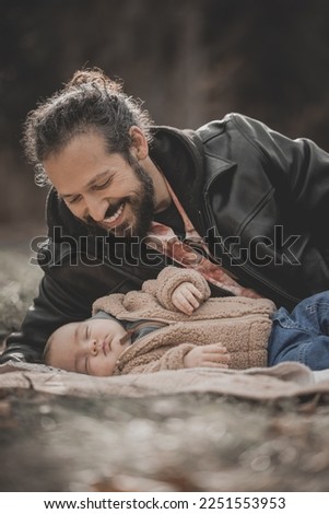 Happy father and son new born fall family photo shoot in forest