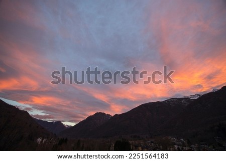 Pink sunset in Italian mountain range of Monte Rosa. No people are visible.