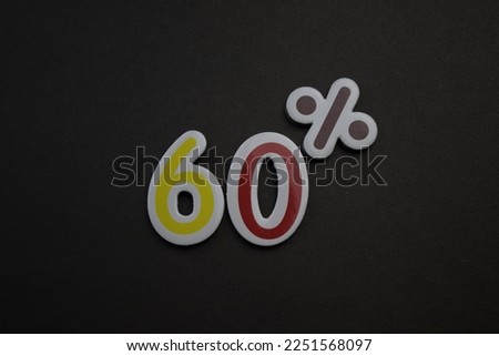 Colorful 60 percent inscription placed on a black background.
