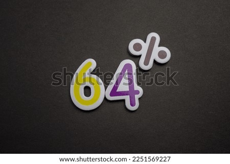 A colorful 64 percent inscription placed on a black background.