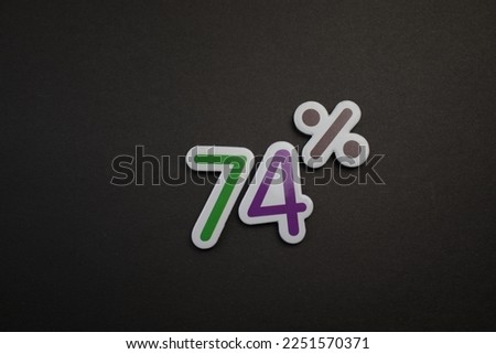 colorful text 74 percent over a black background.