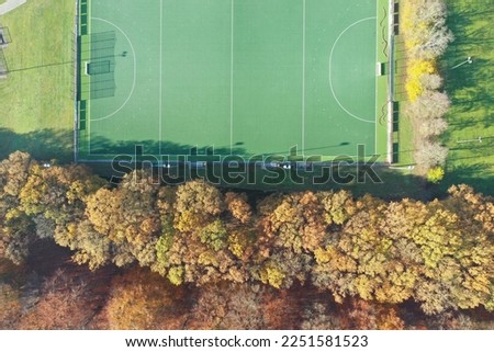 Sporting field from above near autumn forest!