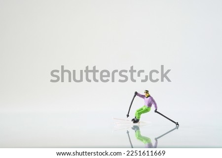 Skier in action on white background