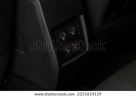 Seat heating controller buttons close up view. Car interior. Seat heater button, car interior. The heating mode is strong.