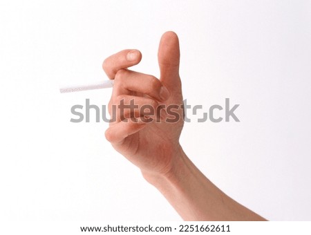 gesture holding cigarette, hand palm isolated on white background