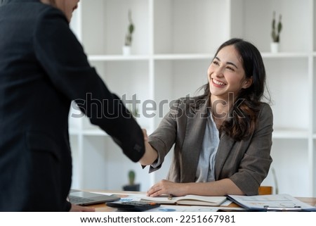 Two Asian businesswomen showing joy and shake and Cheerful Success with New job offer, job promotion. Management. Performance, management concept. Royalty-Free Stock Photo #2251667981