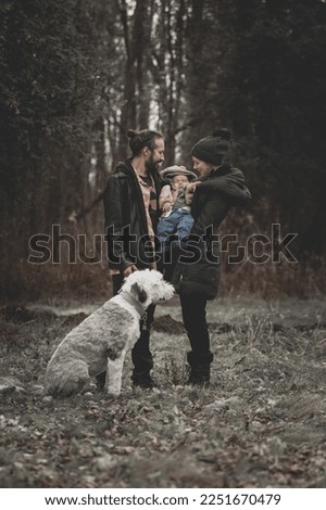New born family photo shoot in the fall by the woods with family dog
