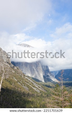 mountain covered in clouds yosemite