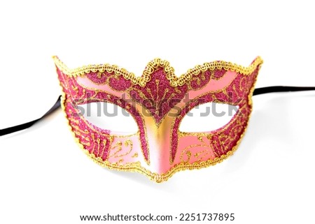Carnival Venetian mask pink color with golden decoration isolated on white background