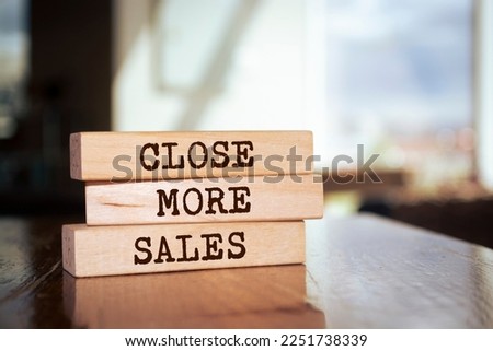 Wooden blocks with words 'Close More Sales'. Royalty-Free Stock Photo #2251738339