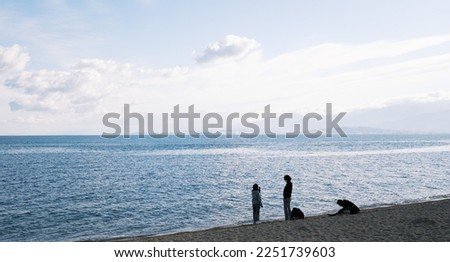 Silhouette of a family playing on a beach in the Seto Inland Sea Royalty-Free Stock Photo #2251739603