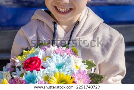 adorable kid child smiling holding big bouquet of chrysanthemum flowers rose and other birthday mother day spring march 8th women's international.cute adorable preschooler boy september back to school