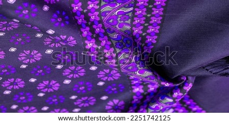 silk fabric of dark blue color with blue and purple flowers, dense fabric, double-sided based on triacetate fibers.