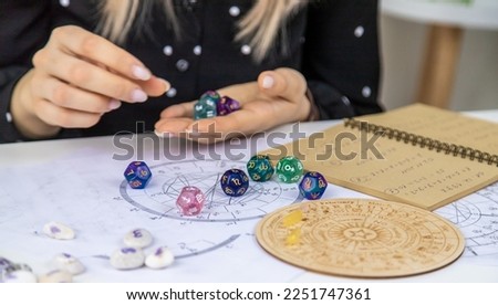 Woman numerologist astrologer counts numbers. Selective focus. People. Royalty-Free Stock Photo #2251747361