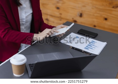 Business woman hand with calculator doing real estate sale, installment payment and mortgage loan concept. 