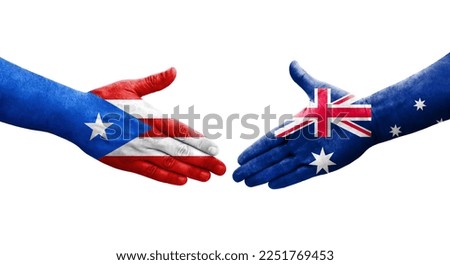 Handshake between Australia and Puerto Rico flags painted on hands, isolated transparent image.