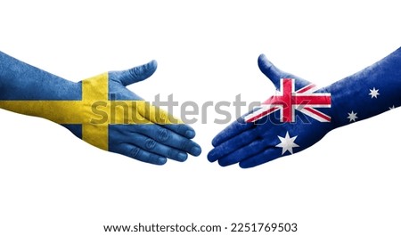 Handshake between Australia and Sweden flags painted on hands, isolated transparent image.