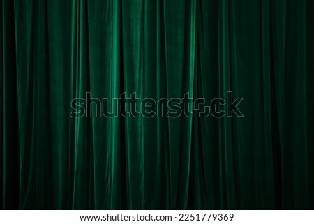 green curtain in theatre. Textured background Royalty-Free Stock Photo #2251779369