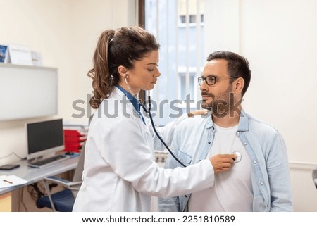 Caring Caucasian female doctor use phonendoscope examine male patient heart rate at consultation in hospital. Woman nurse or GP use stethoscope listen to man heartbeat in clinic.