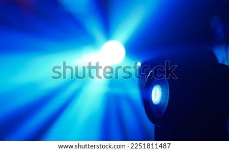 Stage lights with rays shape. Close up view of two blue scene light system used for a party.