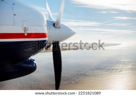 Propellers of a small aircraft that is in the air. picture of an airplane. Port on the North Sea photographed from above
