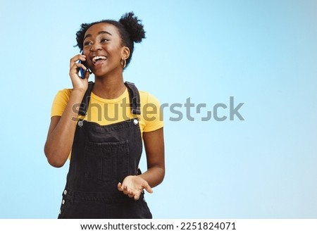 Communication, happy and talking black woman on a phone call isolated on a blue background. Contact, smile and thinking African girl in conversation on a mobile with mockup space on a studio backdrop Royalty-Free Stock Photo #2251824071