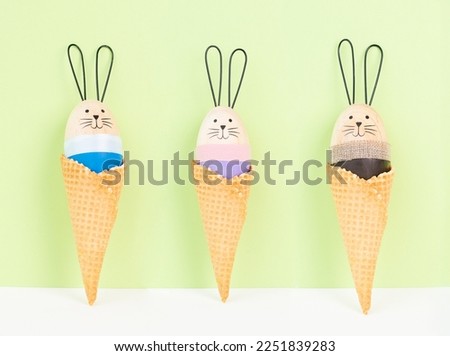 Cute easter bunny or rabbit in an ice cream cone, spring holiday, greeting card 