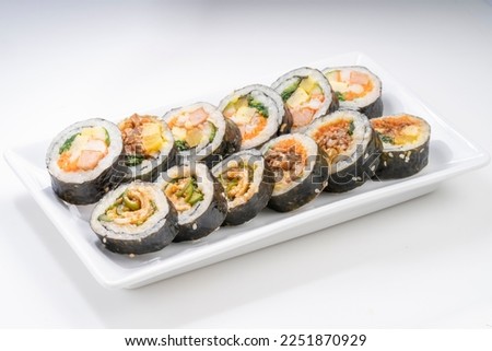 Korean Seaweed Rice Rolls or Kimbap Korean dish made from cooked rice  vegetables, meats that are rolled in seaweed, BBQ Kimbap Korean food. Royalty-Free Stock Photo #2251870929
