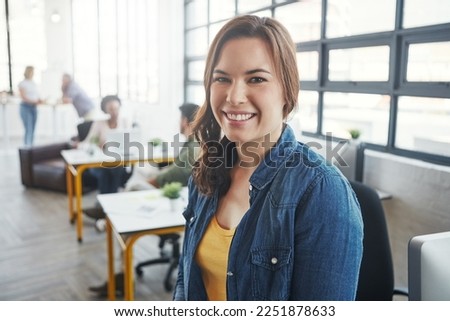 Creative business woman, manager and smile for management, career or vision at the office. Portrait of a young designer standing and smiling in happiness for job, goals or startup at the workplace