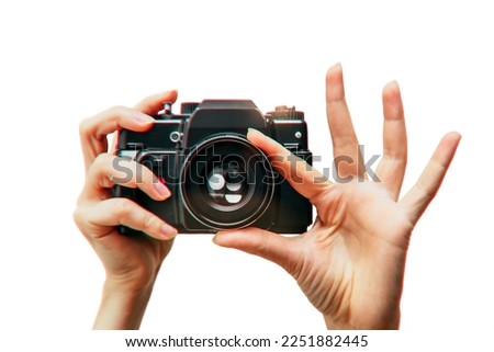 Vintage camera in female hand on white background. Minimalistic still life. Concept art Aberrations Royalty-Free Stock Photo #2251882445