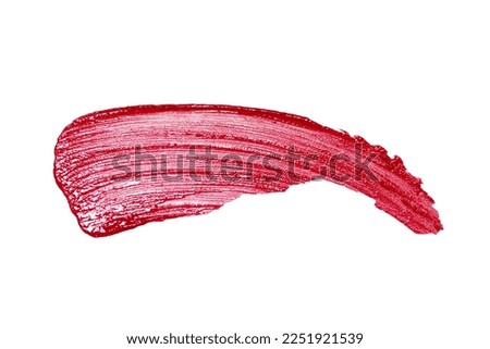 Smudged red lipstick isolated on white background. Lipstick smear sample