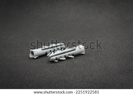 Wall screw nail anchor used to fasten screws in the wall