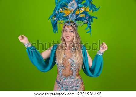 Brazilian Dressed Samba Costume. Beautiful samba dancer with blue dress ready for carnival pointing to free space for text