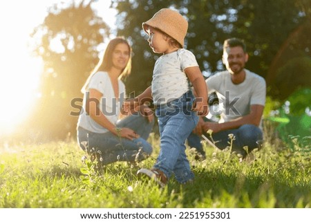 Happy cute family outdoors on sunny day