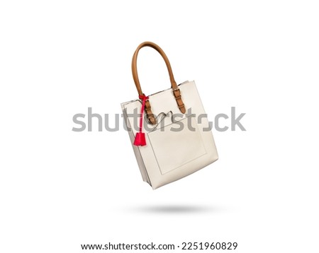 White woman leather handbag floating on a white background with copy space