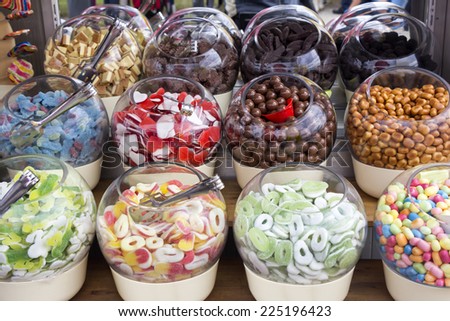 Assortment of colorful sweets and candies in glass bowls Royalty-Free Stock Photo #225196423