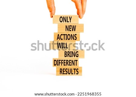 New action symbol. Concept words Only new actions will bring different results on wooden blocks. Beautiful white background copy space. Businessman hand. Business new action and result concept.