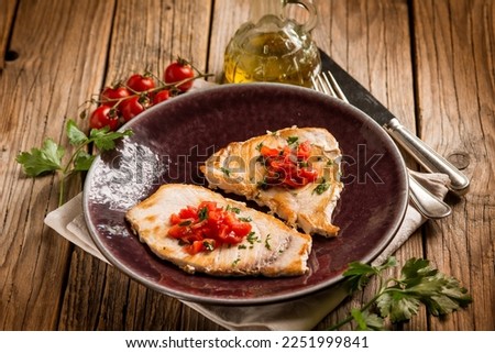 grilled swordfish with diced tomatoes Royalty-Free Stock Photo #2251999841