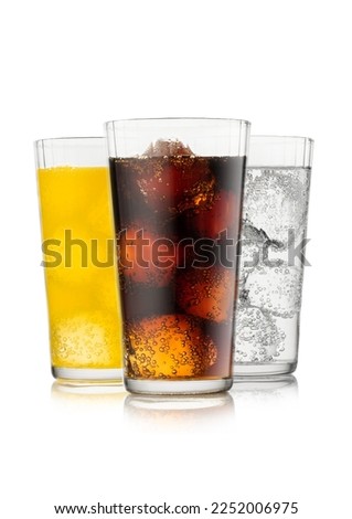 Cola soda drink with lemonade and orange soda with ice cubes and bubbles on white background. Royalty-Free Stock Photo #2252006975
