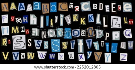 Alphabet letters newspapers scraps and hand draw isolated on black background and texture, top view, clipping path