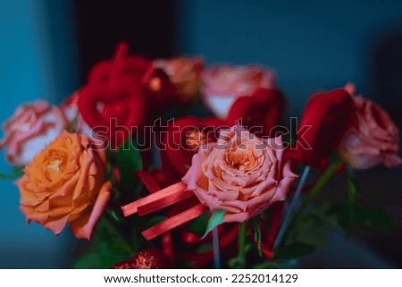 red roses with red hearts, a bouquet of roses with hearts for Valentine's Day, a bouquet of roses for March 8. High quality photo