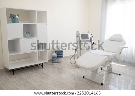 The sculp body treatment machine with a white bad in the white room, cabinet in the cosmetology, beauty center, clinic, salon.Cosmetology devices. Royalty-Free Stock Photo #2252014165