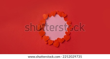 Hearts on a red background with copy space. The concept of love, Valentine's day.