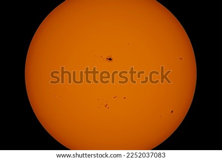 the sun with biggset sunspot in the dark Royalty-Free Stock Photo #2252037083