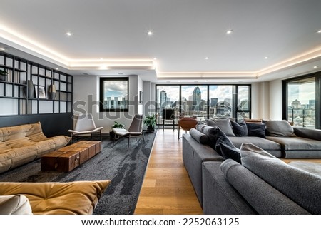 Modern apartment building in Montreal, Griffintown with amenities, city views, reception areas, patio and other common areas