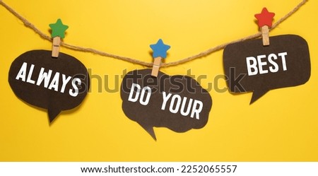 'Always do your best' words on a lightbox on a white wooden background, top view. Overhead, from above, flat lay.