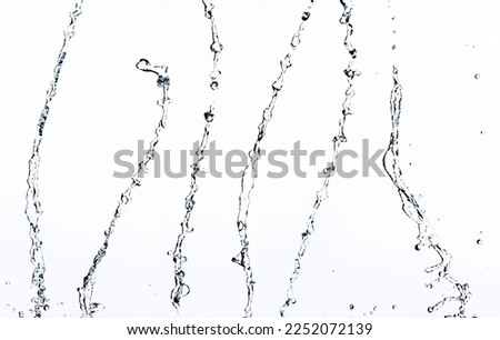 Shape form droplet of Water splashes into drop water line tube attack fluttering in air and stop motion freeze shot. Splash Water for texture graphic resource elements, White background isolated Royalty-Free Stock Photo #2252072139